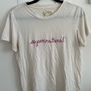 White “supernatural” tee